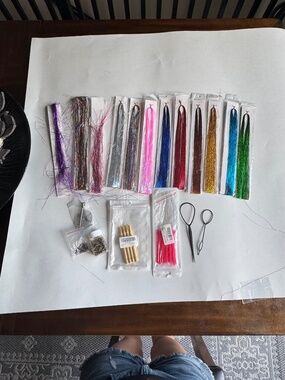 Hair colored tinsel hair extensions and tools.